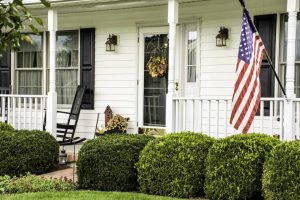 front porch with american flag