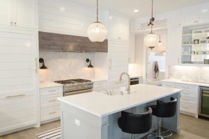 modern kitchen remodeling project with hanging light fixtures